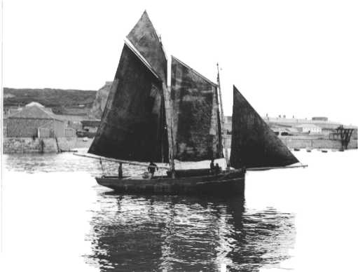 A schooner rigged working boat in London Bay, St Helier harbour in the 1890s